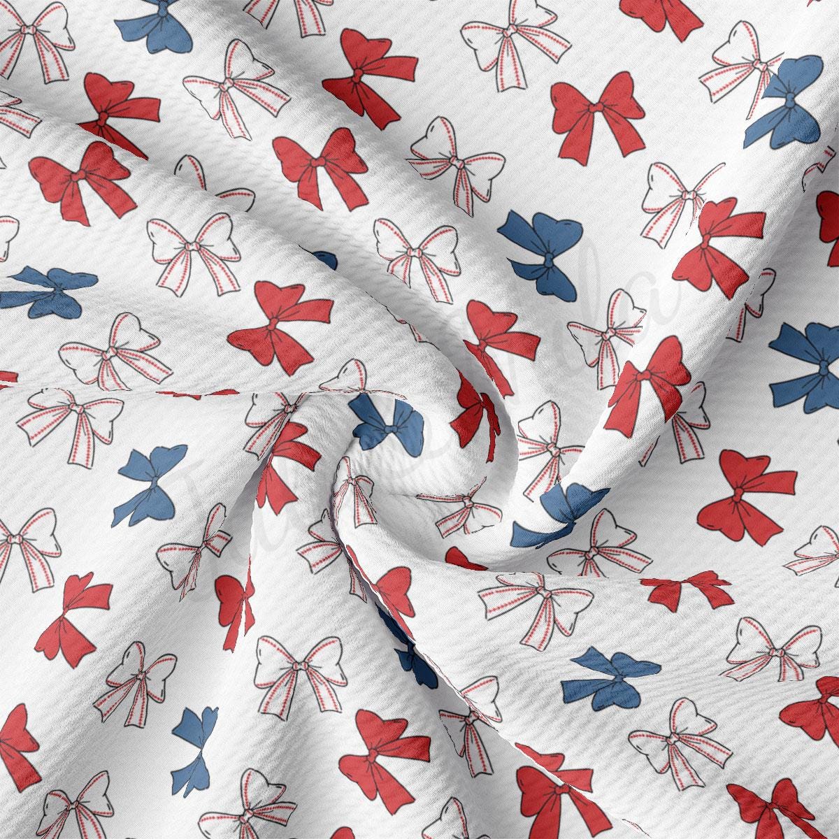a red, white, and blue bow print fabric