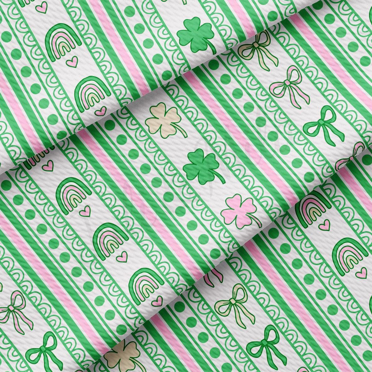 a green and pink striped fabric with shamrocks