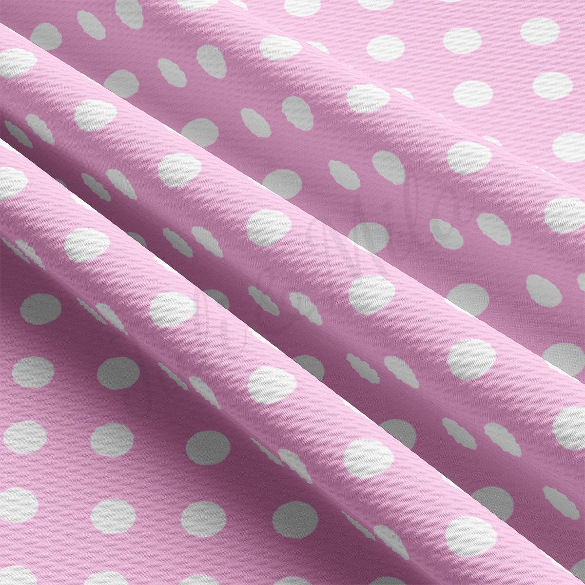 a pink and white polka dot print fabric