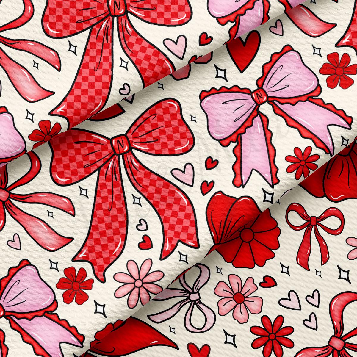 a pattern of red bows and flowers on a white background.