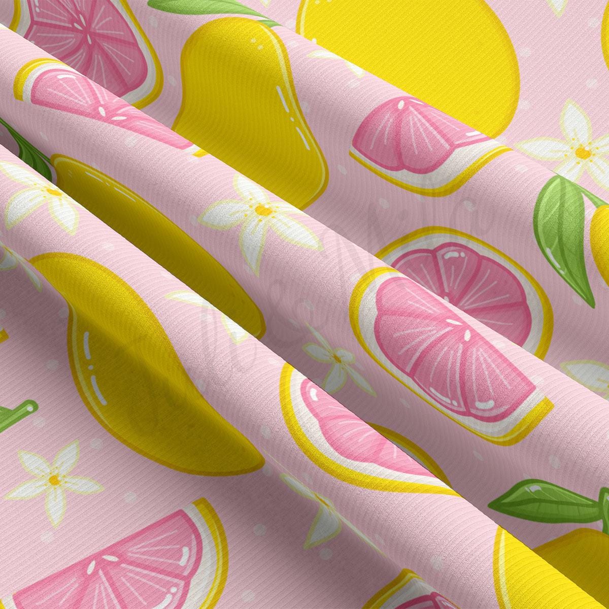 a pink and yellow wallpaper with lemons and grapefruits