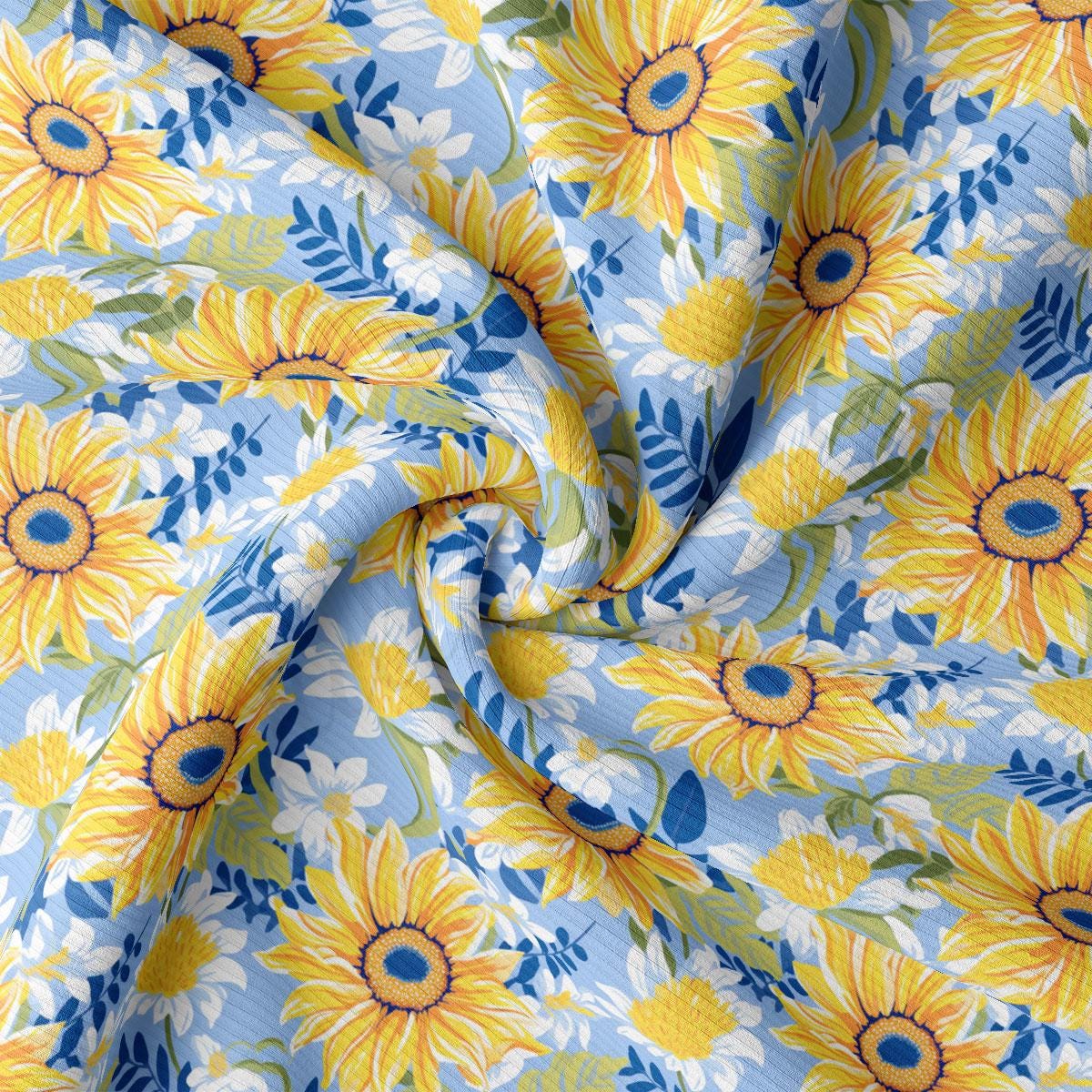 a sunflower print fabric with blue and yellow flowers