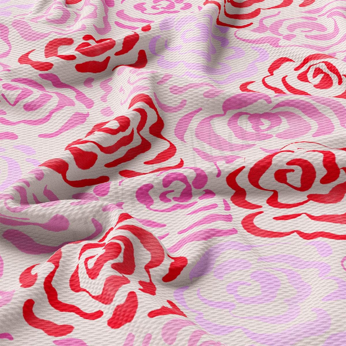 a close up of a pink and red fabric