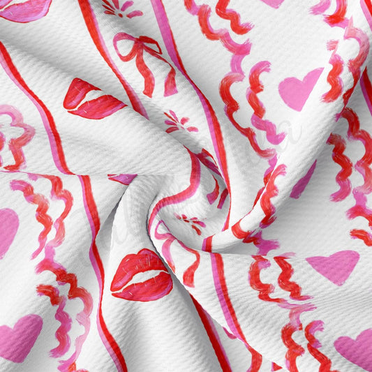 a close up of a pink and red heart print fabric