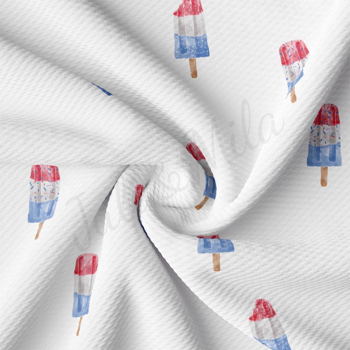 a white fabric with popsicles on it
