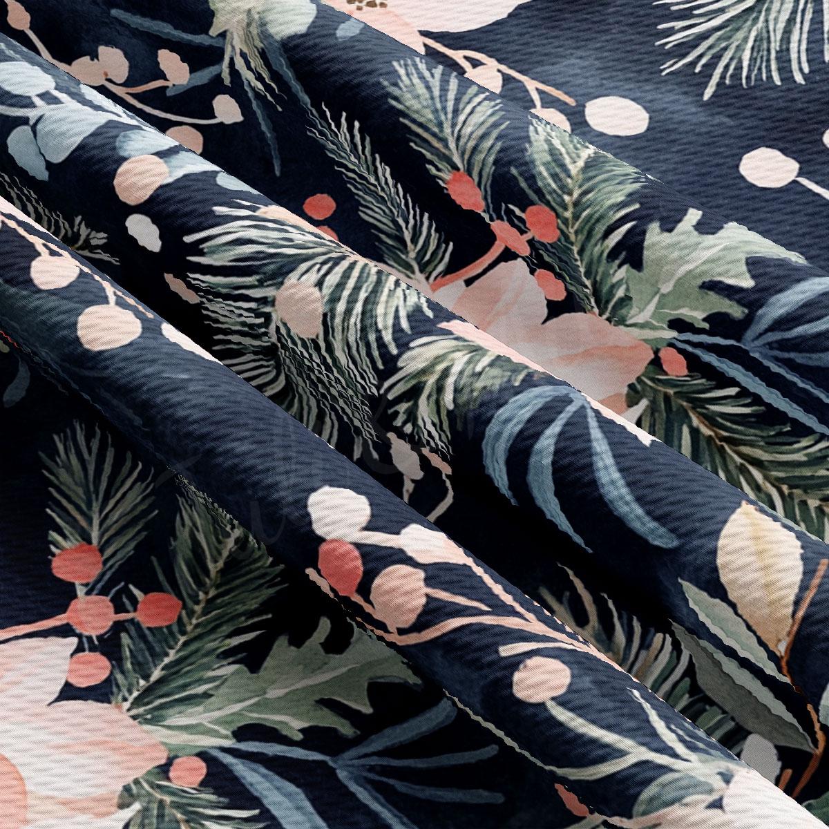 a close-up view of a fabric with a floral pattern, including leaves, berries, and flowers in shades of blue, green, and pink.