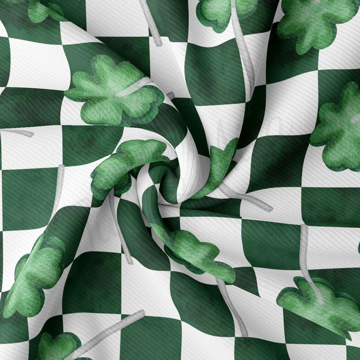 a green and white checkered fabric with shamrocks on it