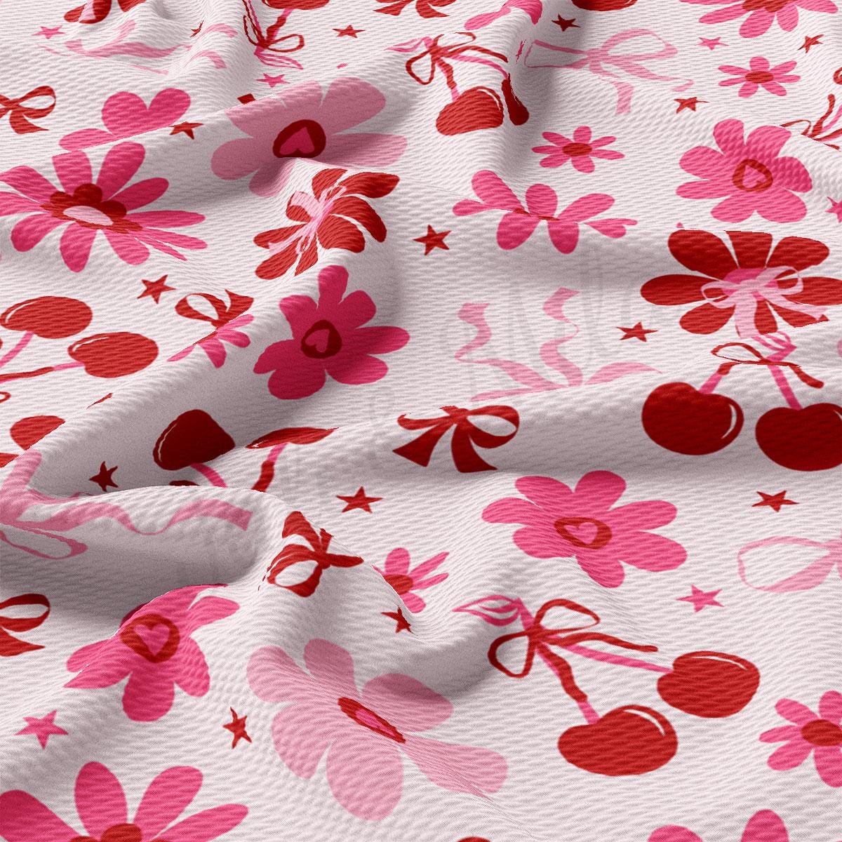 a close up of a pink and red flowery fabric