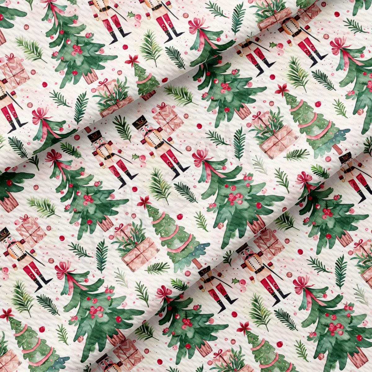 a repeating pattern of Christmas trees, nutcrackers, and presents on a white background.
