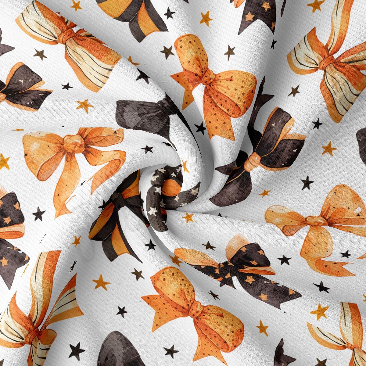 a close-up view of a fabric with a repeating pattern of orange and black bows, along with scattered stars.