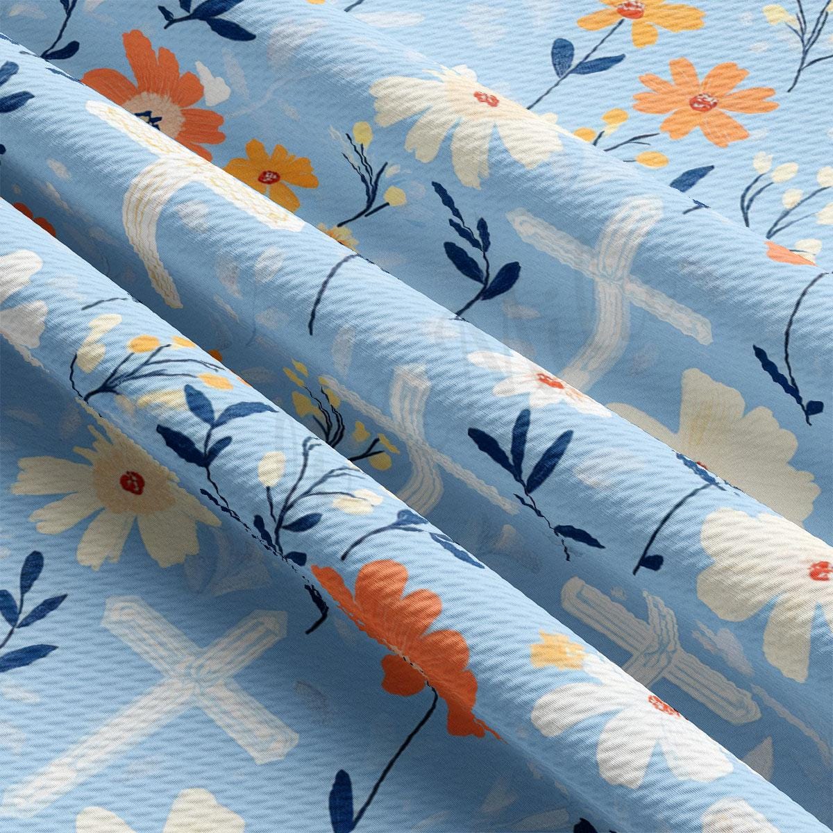 a close up of a blue and orange flowered fabric