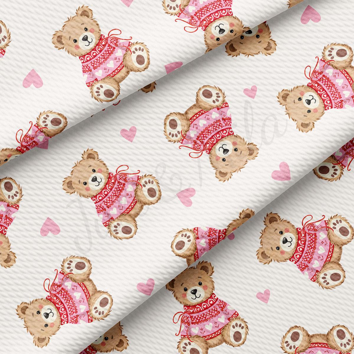 a repeating pattern of teddy bears wearing pink sweaters and hearts on a white background.