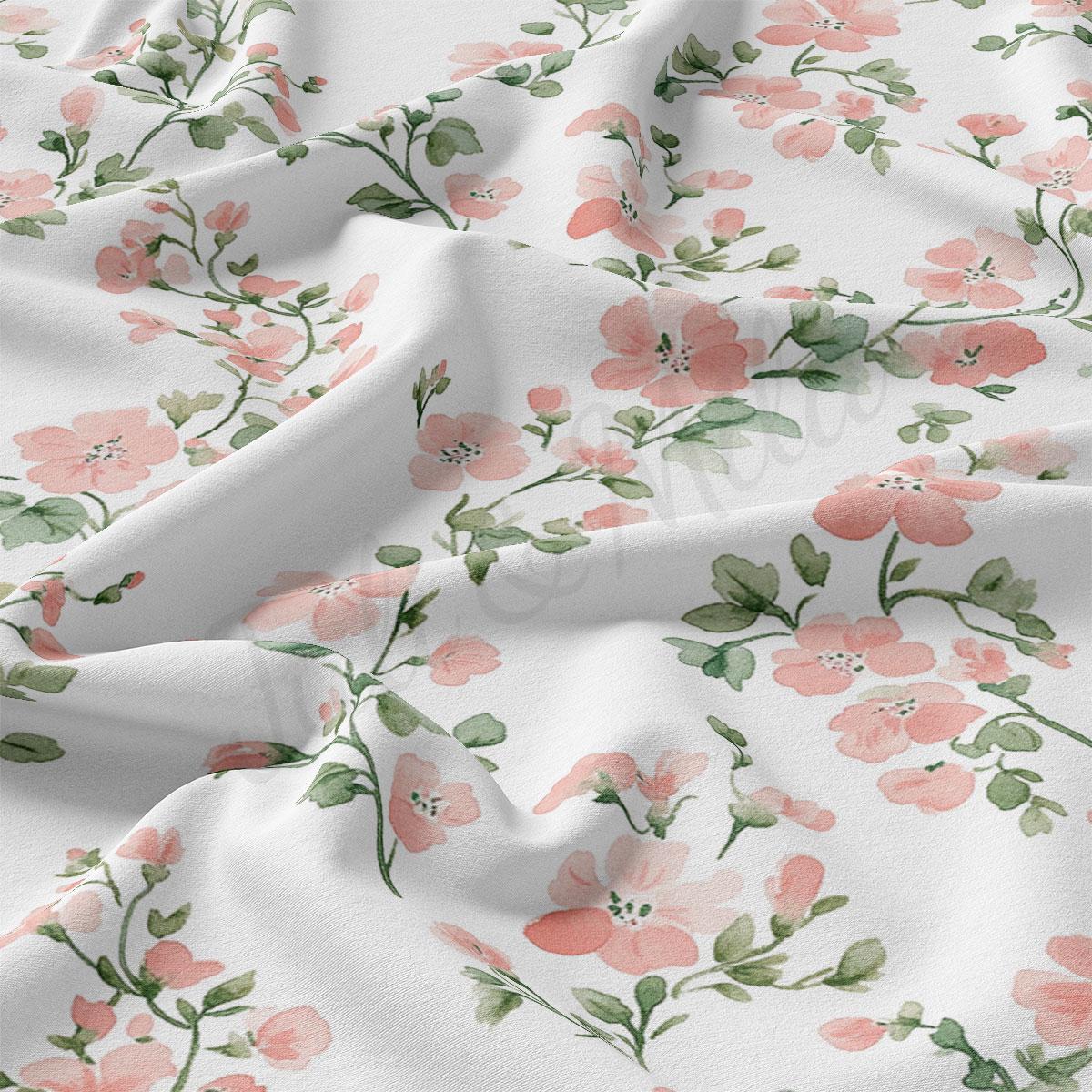 a close-up view of a fabric with a floral pattern of pink flowers and green leaves. The fabric appears to be white, and the pattern is intricate and detailed, with the flowers and leaves filling the entire visible area of the fabric.