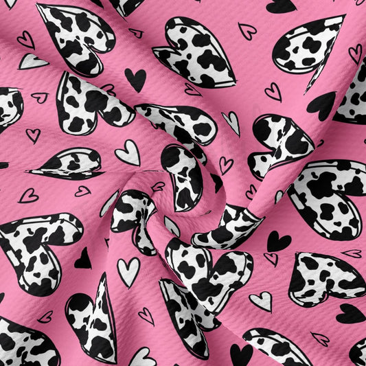 a pink background with black and white hearts and hearts