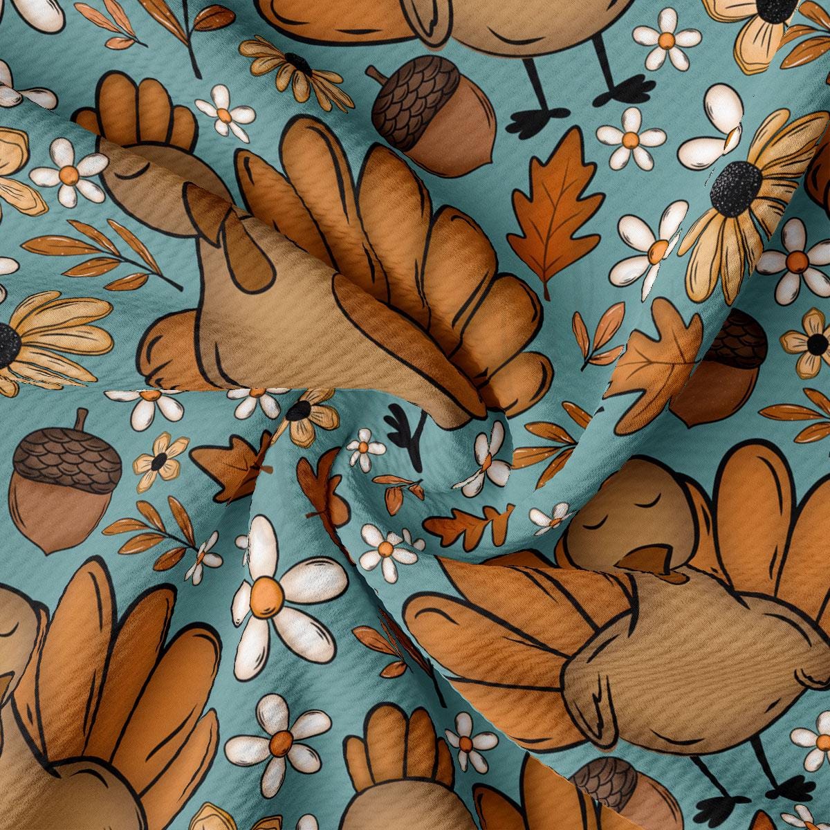 The image is a close-up of a fabric with a repeating pattern of turquoise background, brown turkey, white flowers, and brown acorns.