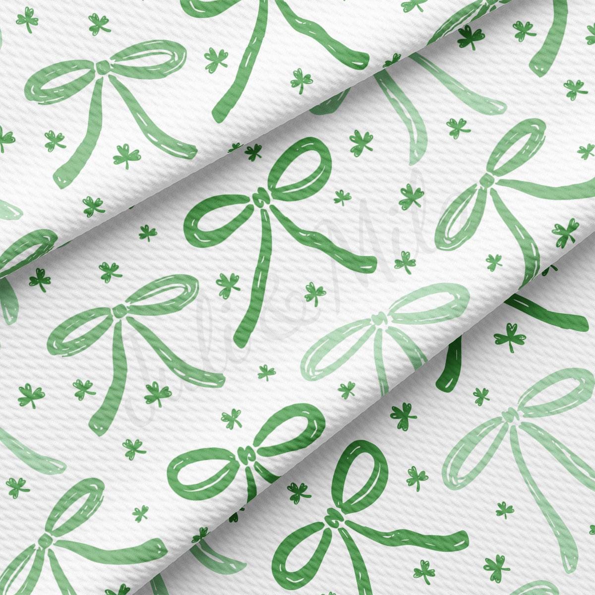 a green and white background with bows
