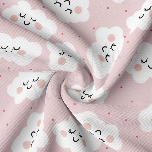 a pink and white fabric with clouds on it
