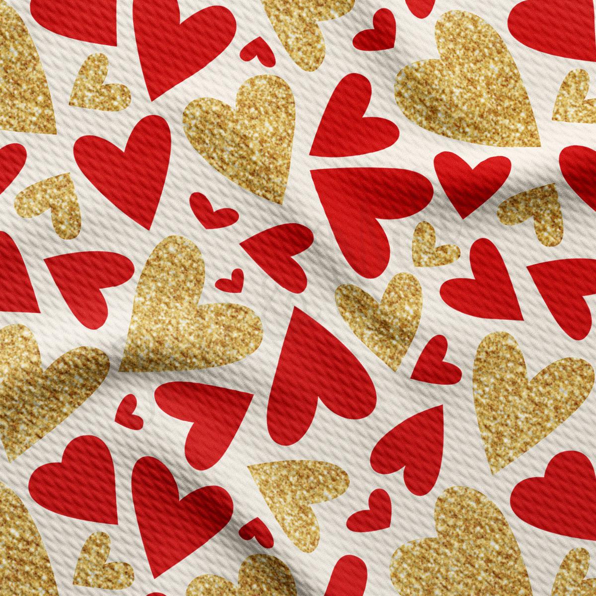 a pattern of red and gold glitter hearts on a white background.