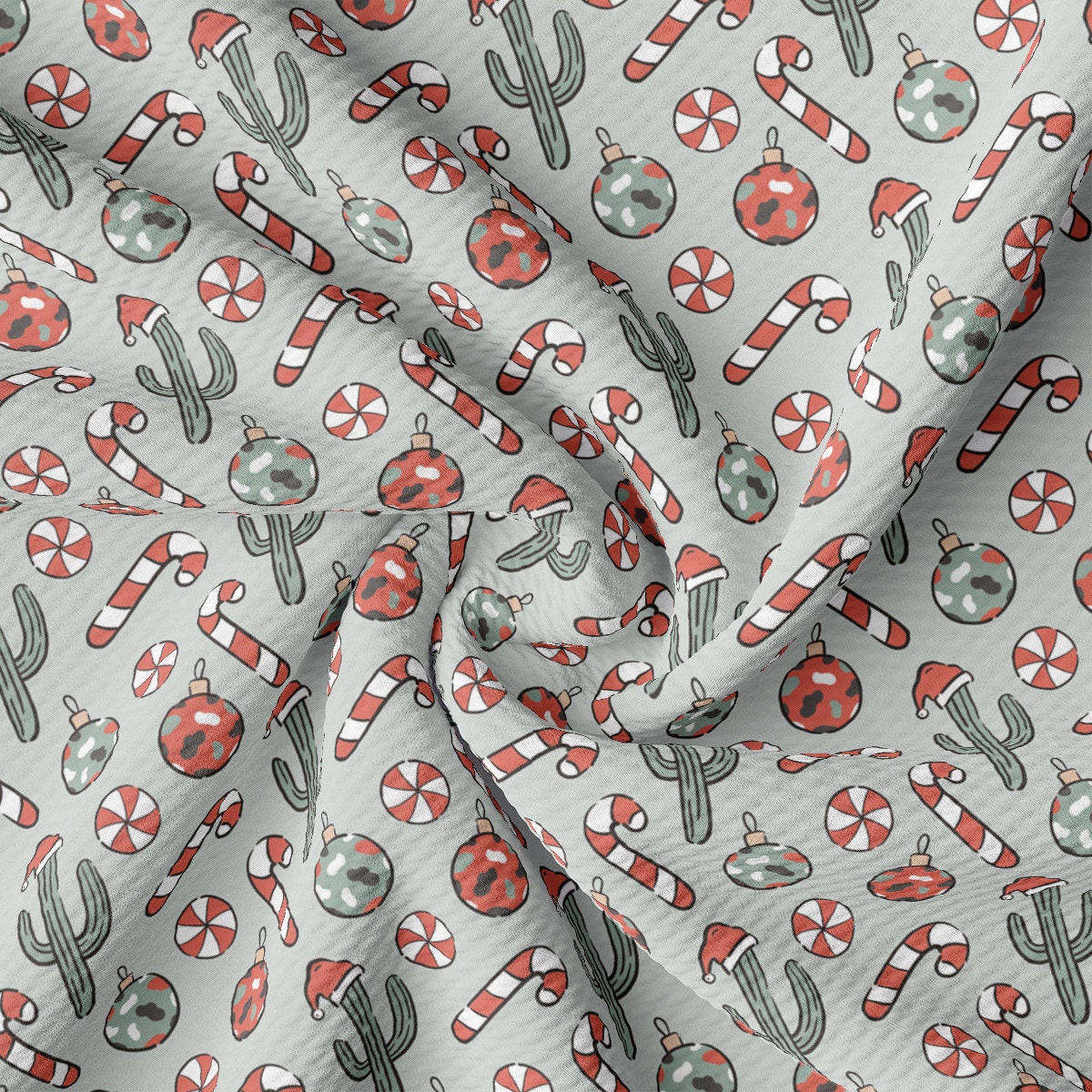 a close up of a white fabric with a cactus pattern