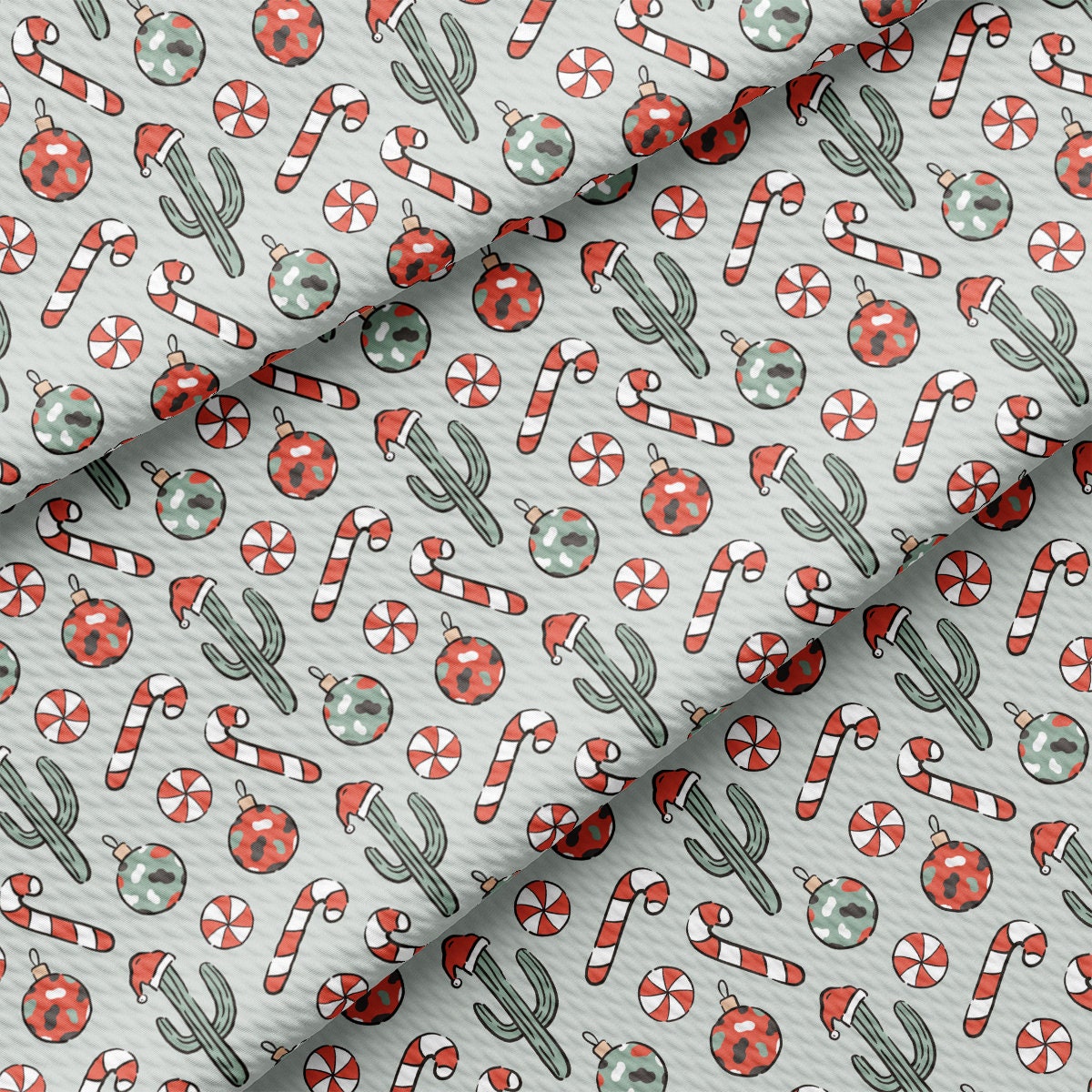 a pattern of candy canes and cactus on a white background