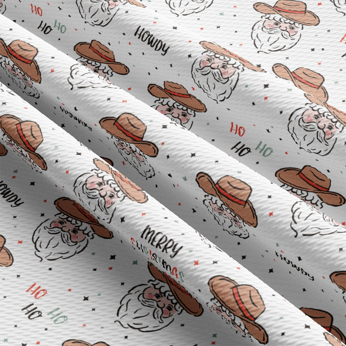 a close up of a white wrapping paper with santa claus on it