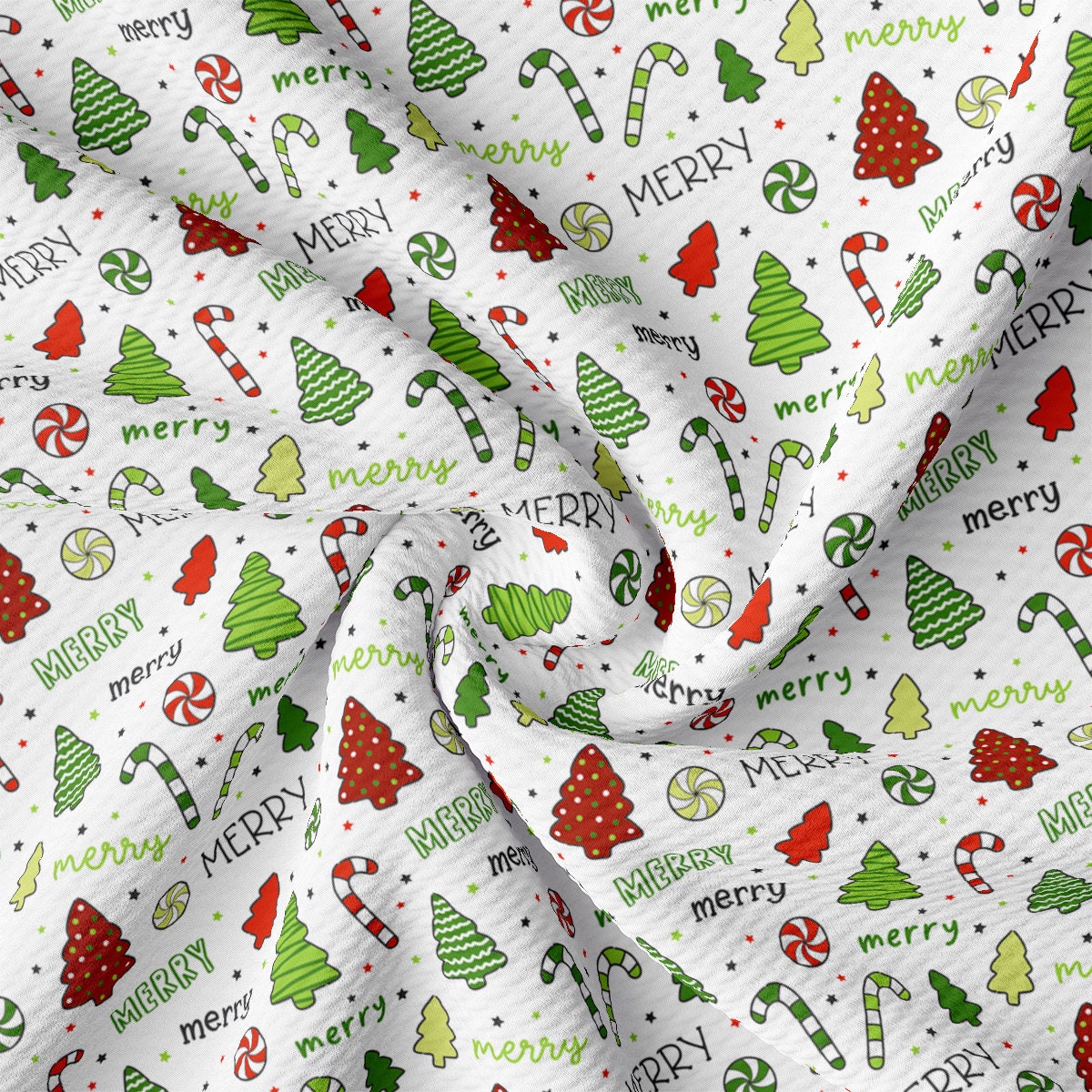 a white fabric with christmas trees and candy canes