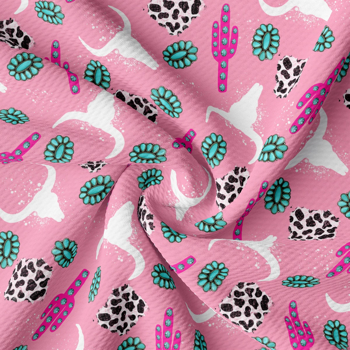 a pink fabric with a pattern of cactus and flowers