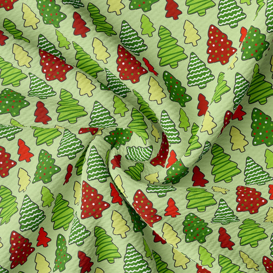 a green and red christmas tree print fabric