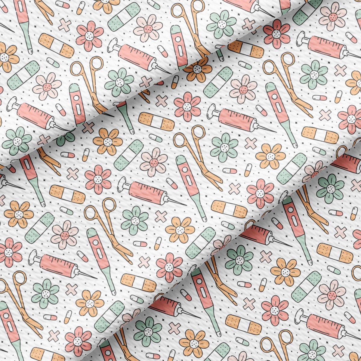 a close up of a pattern with scissors and flowers