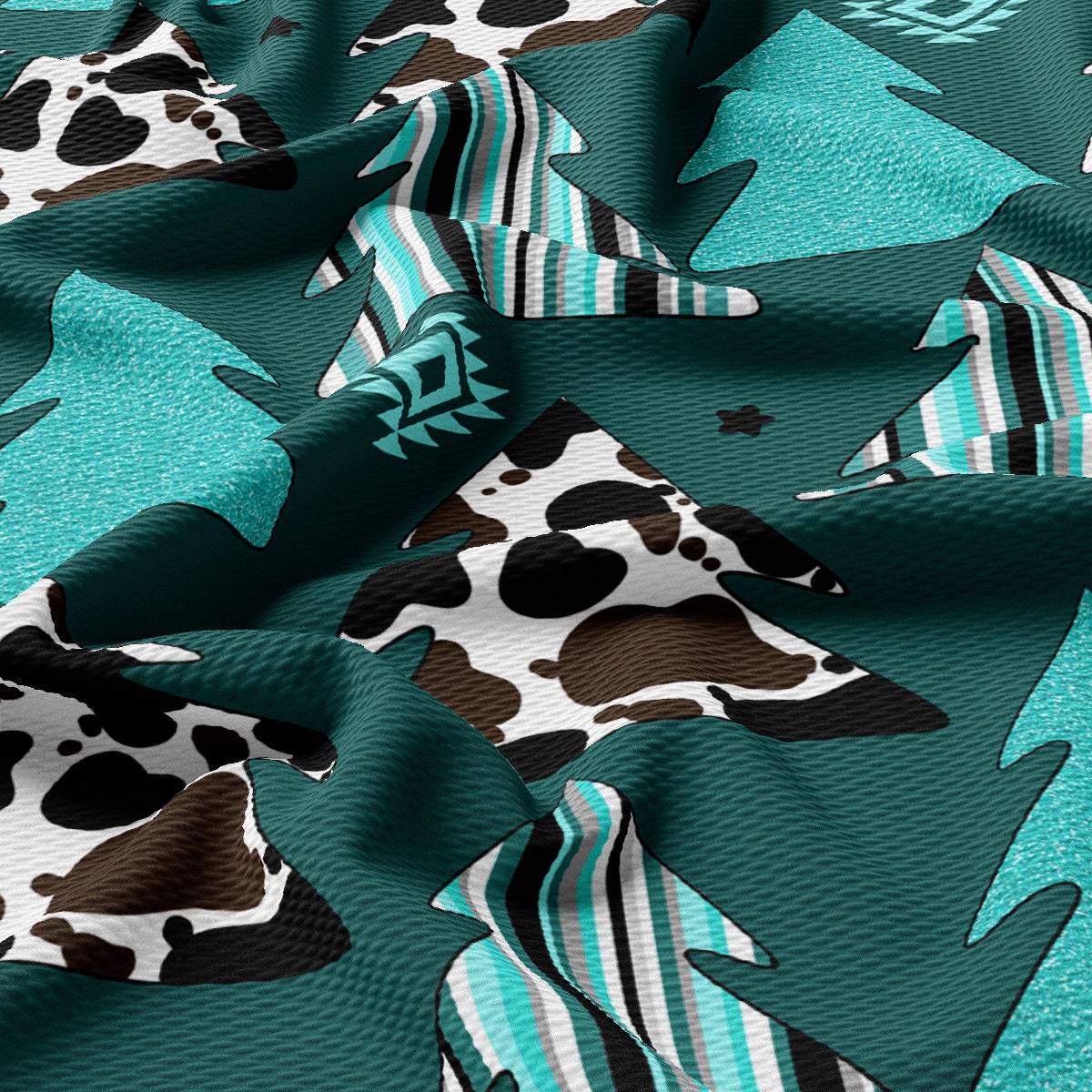 a close up of a cow print fabric