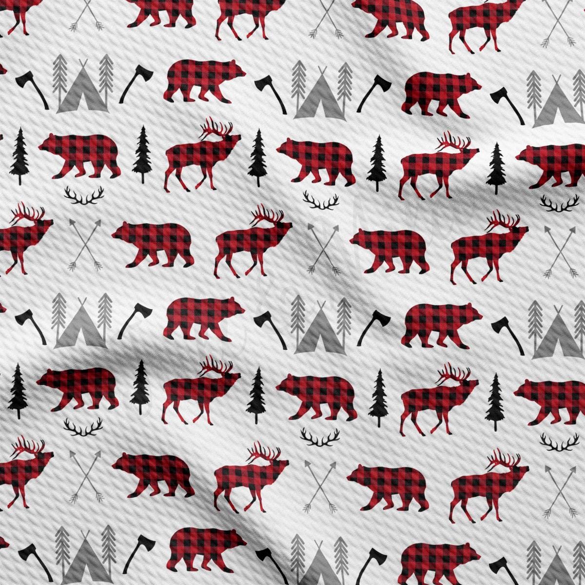 a pattern of moose and trees on a white background