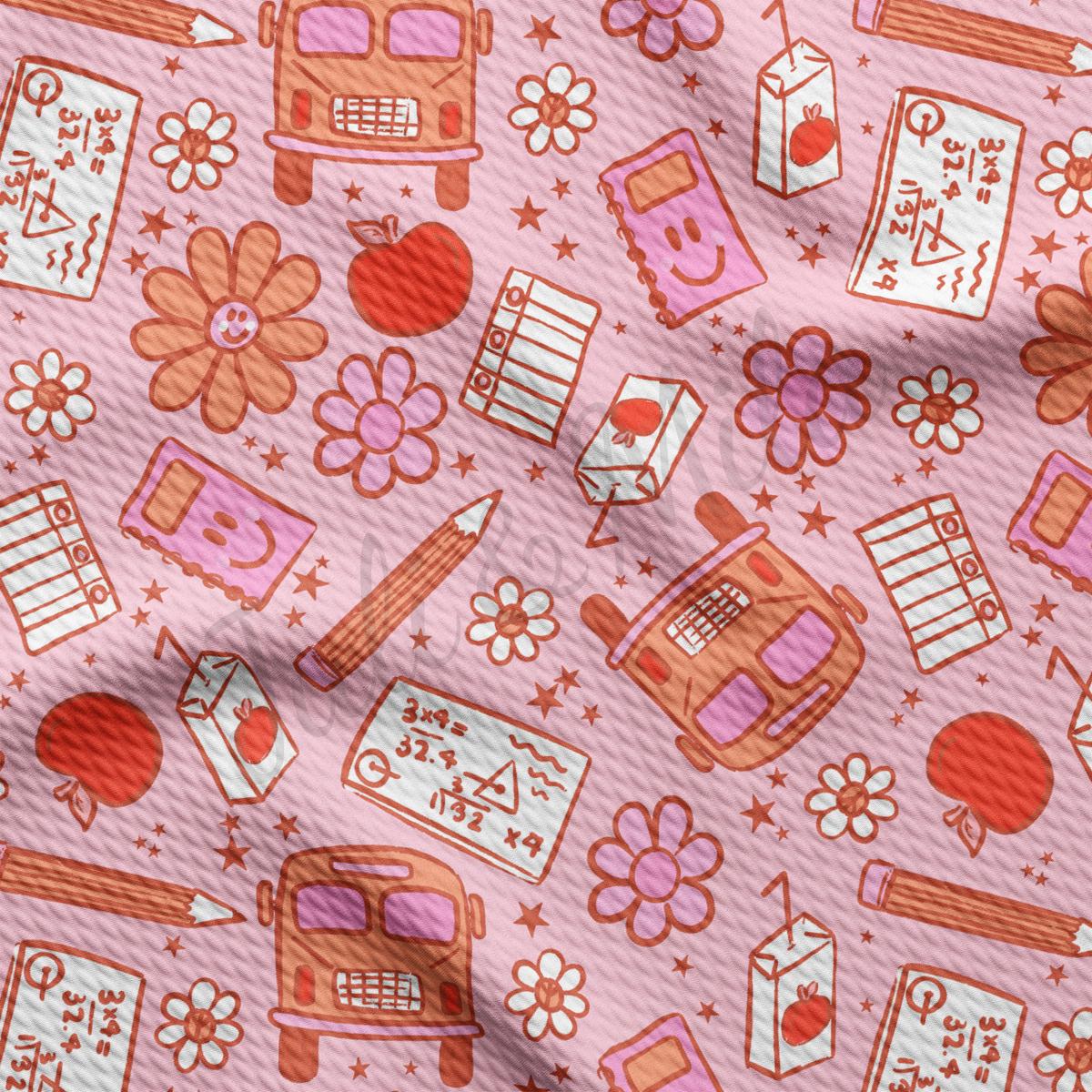 a close up of a pink fabric with a pattern of different things on it