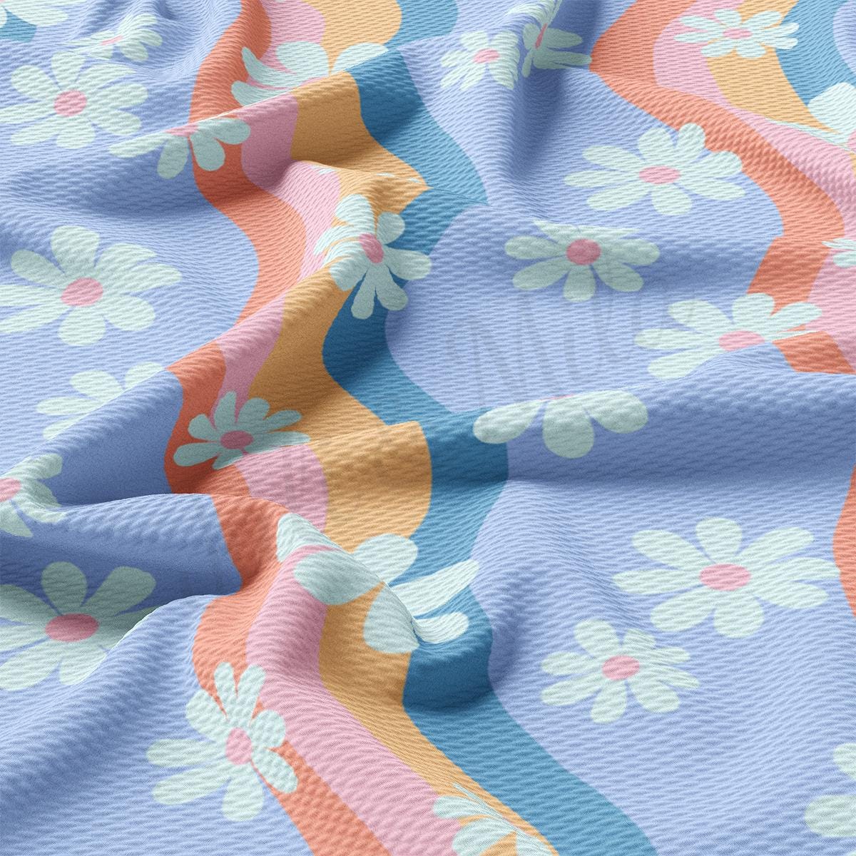 a close up of a blue and pink flowered fabric
