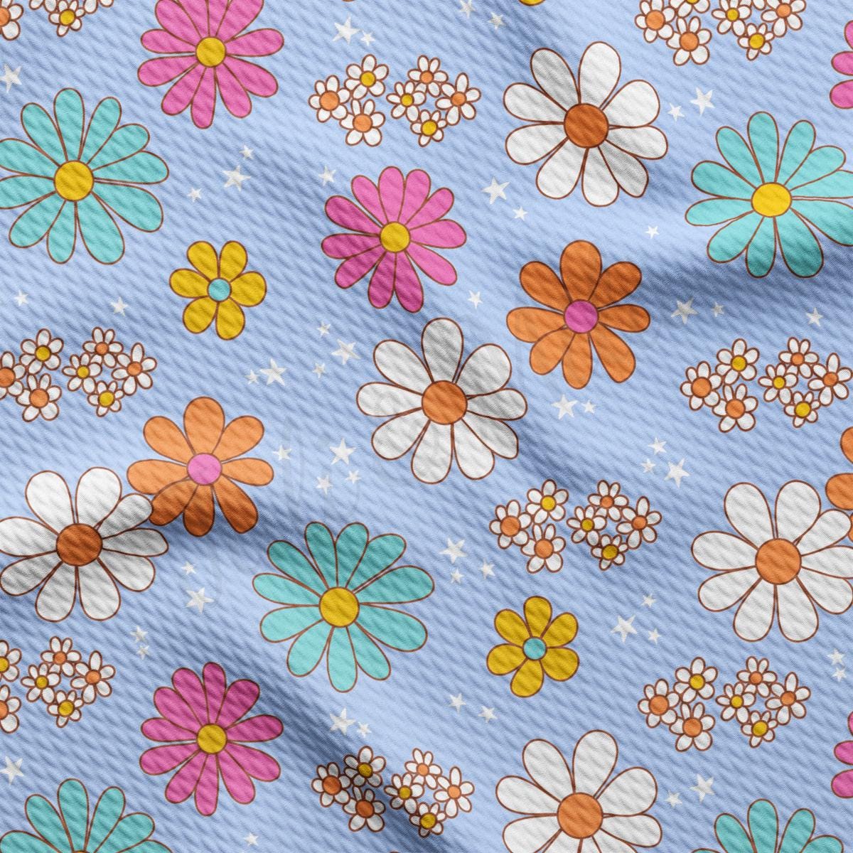 a blue background with a bunch of flowers on it