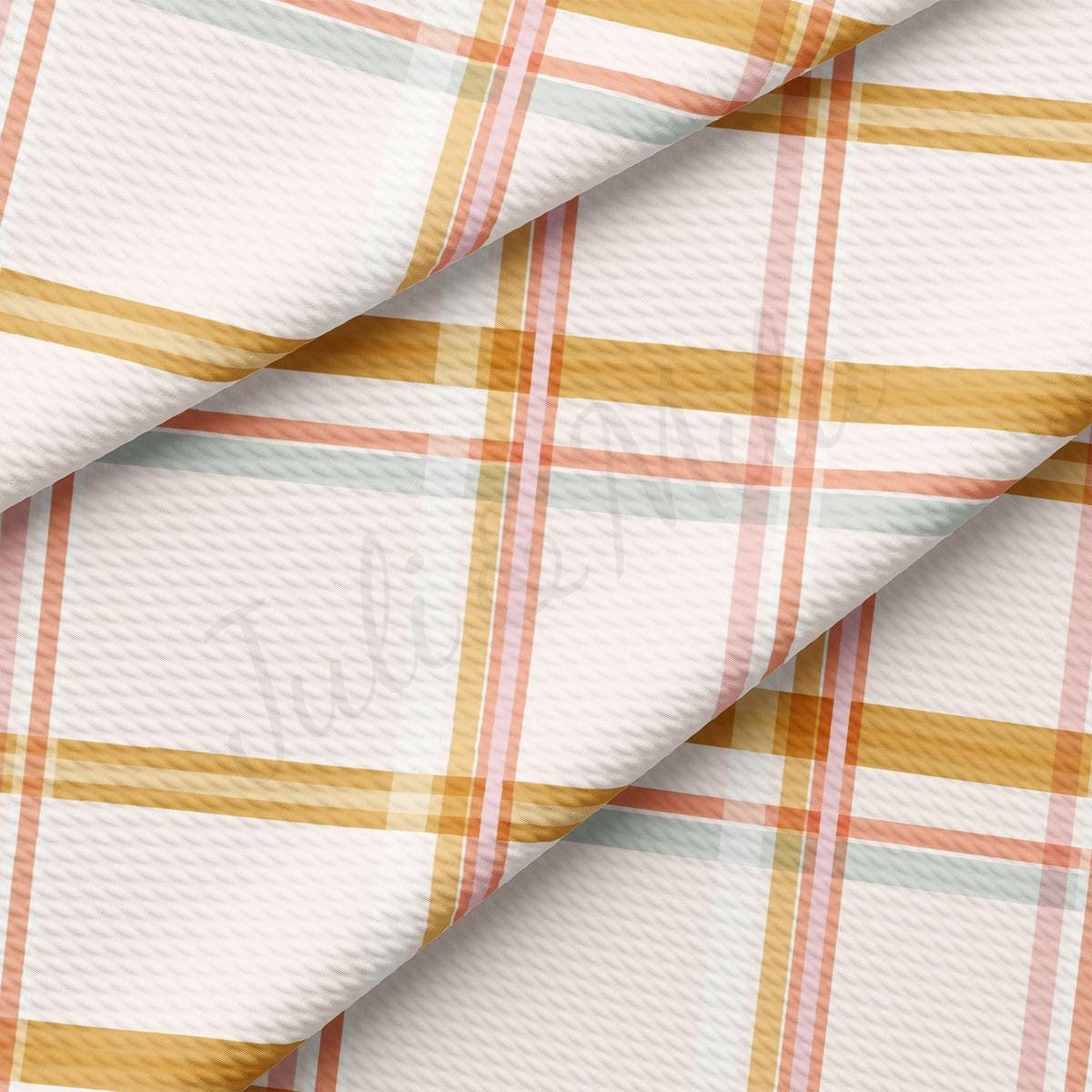 a close up of a white and orange plaid fabric