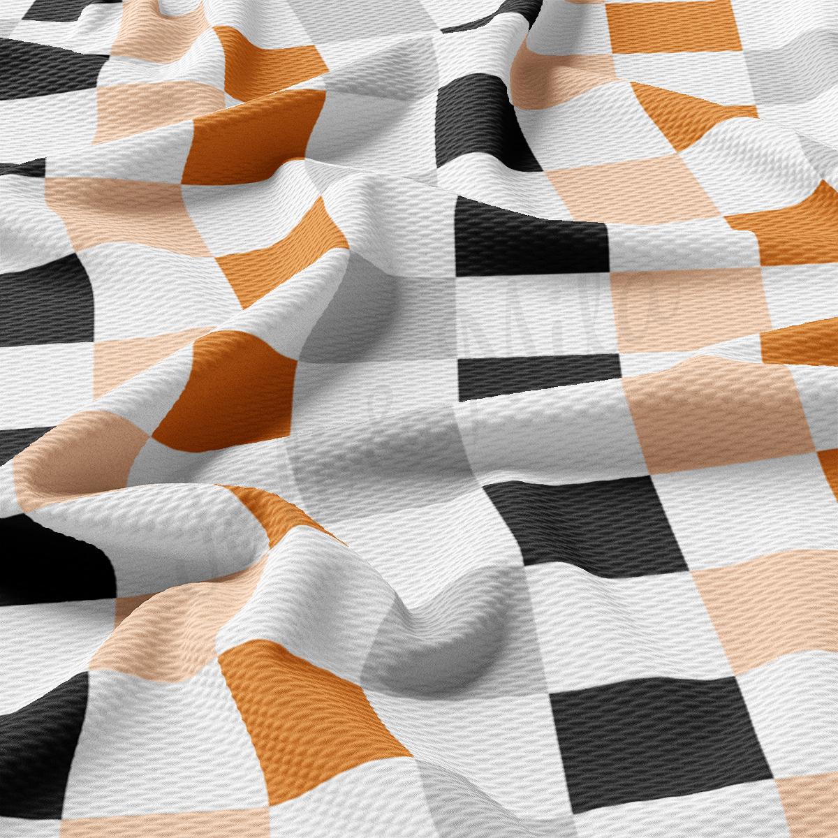 a checkered fabric with orange and black stripes