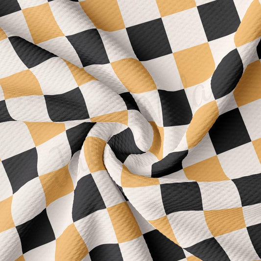 a black and yellow checkered fabric with a white background