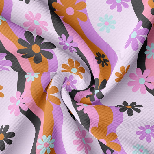 a close up of a pink and orange flowered fabric