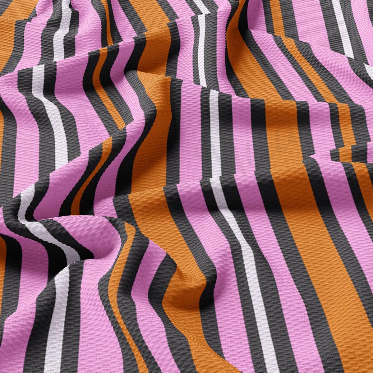 a close up of a pink and black striped fabric