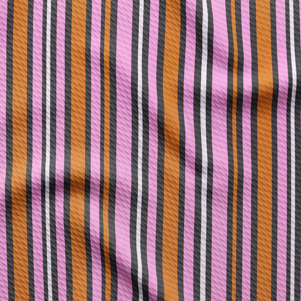 a close up of a pink and black striped fabric