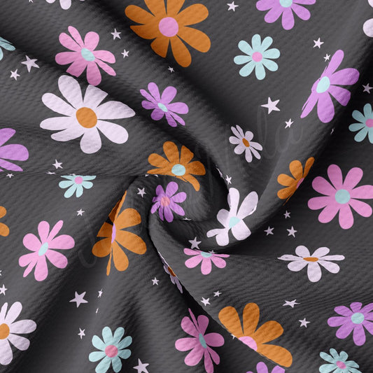a fabric with flowers and stars on it