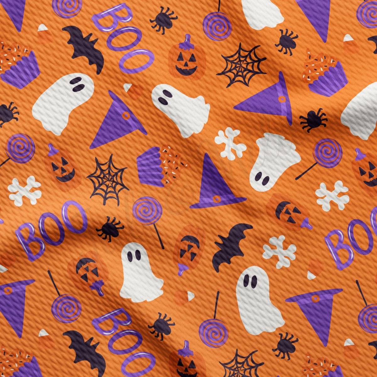 a pattern of halloween themed items on an orange background