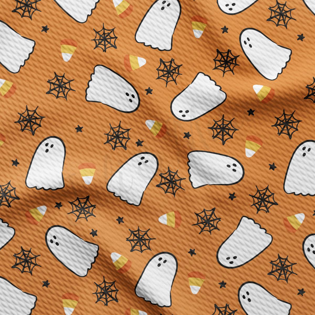 a pattern of ghost and stars on an orange background