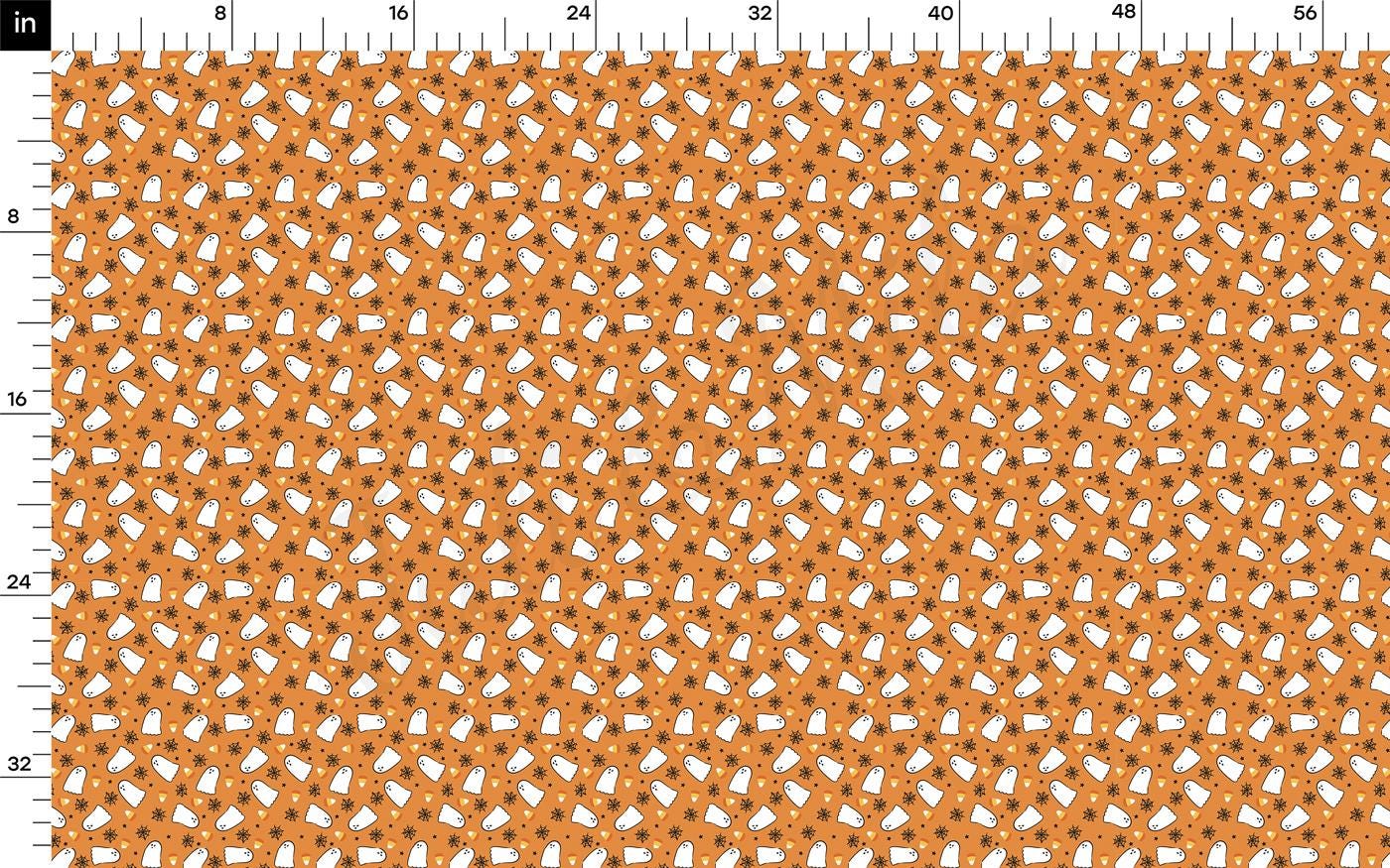 an orange and white crochet pattern on a ruler