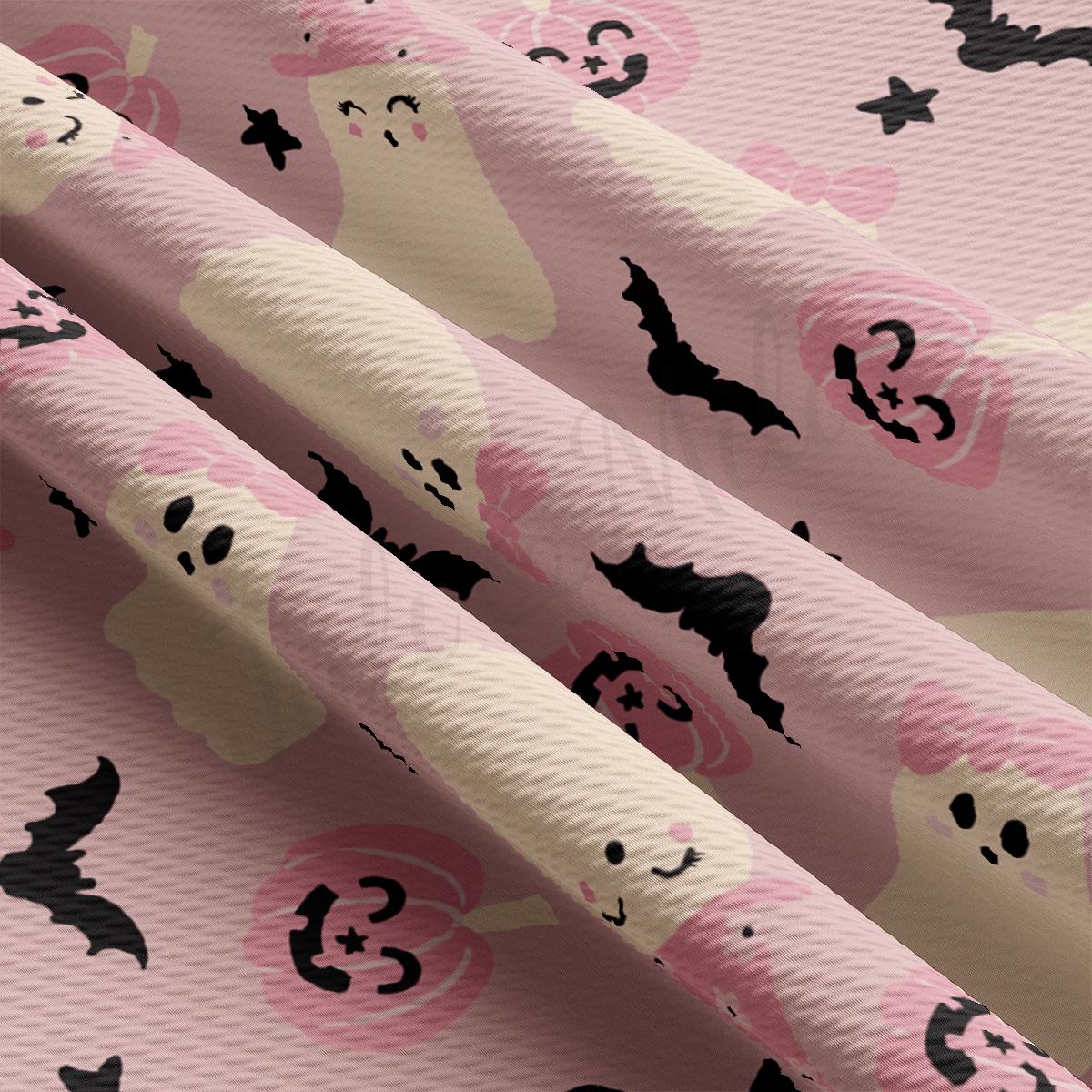 a pink background with black and white skulls and bats