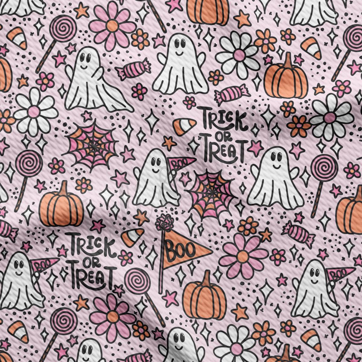 a pattern of halloween themed items on a pink background