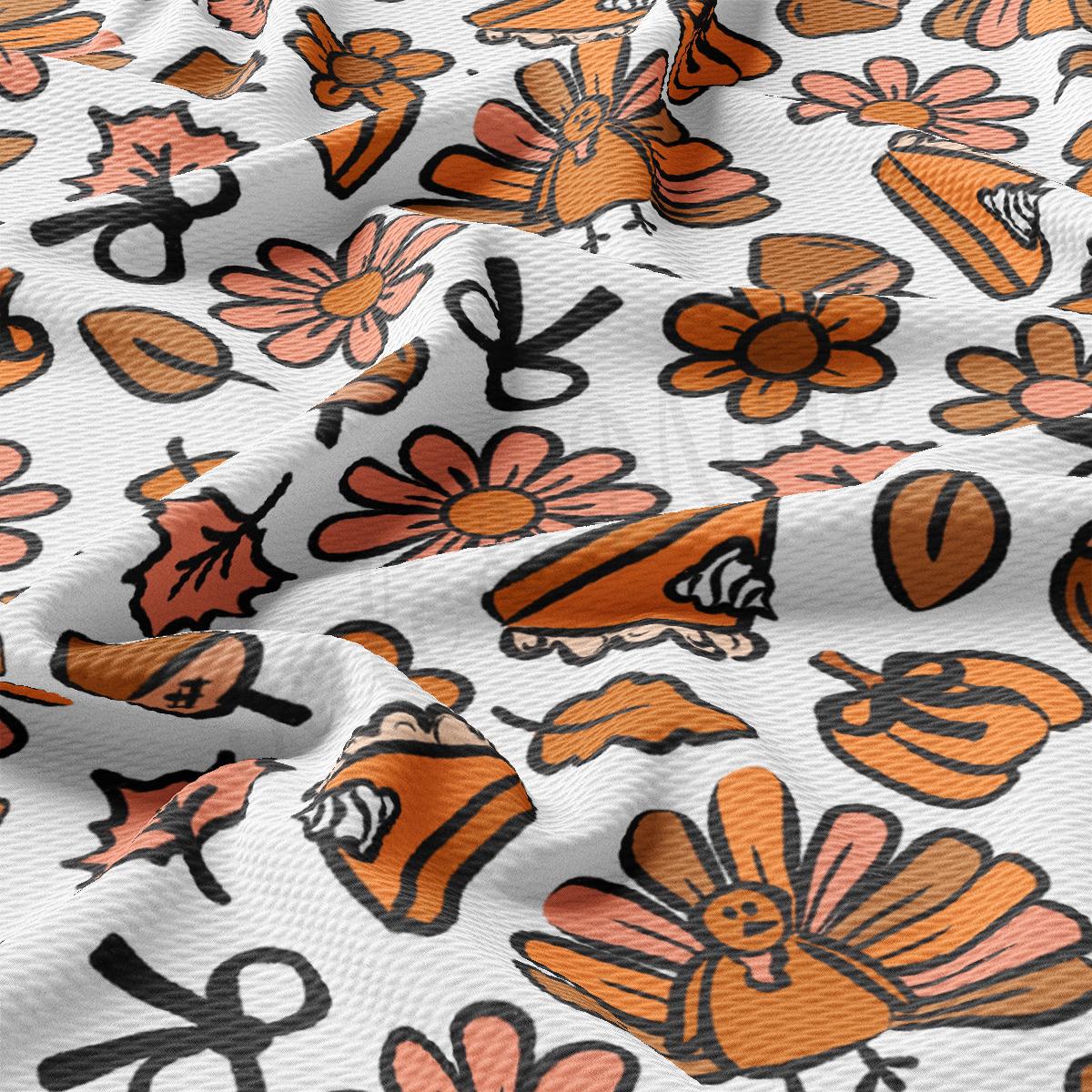 an orange and black floral print on a white background