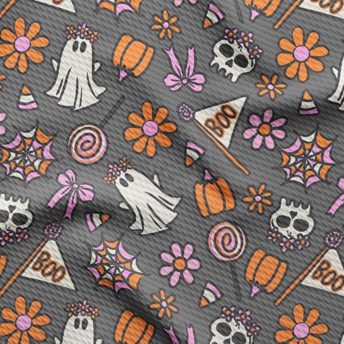 a pattern of halloween items on a gray background