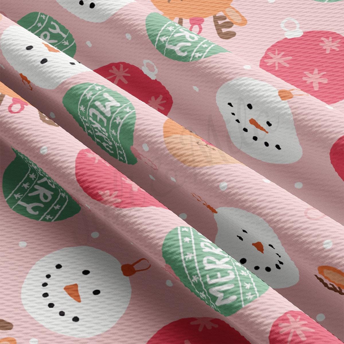 a pink wrapping paper with a snowman pattern on it