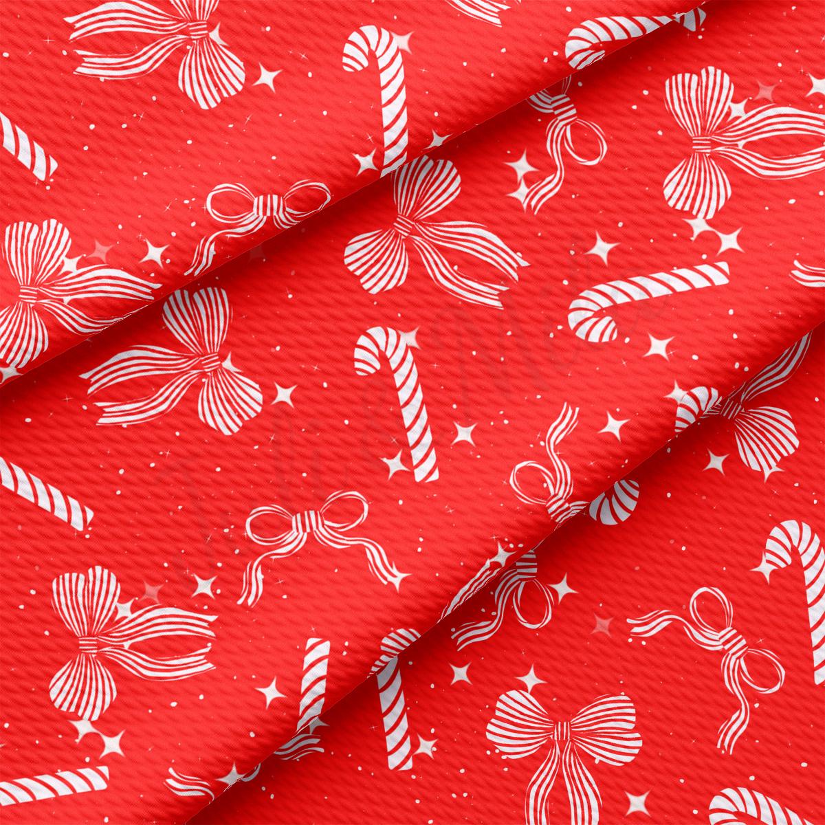 a red background with white candy canes and stars